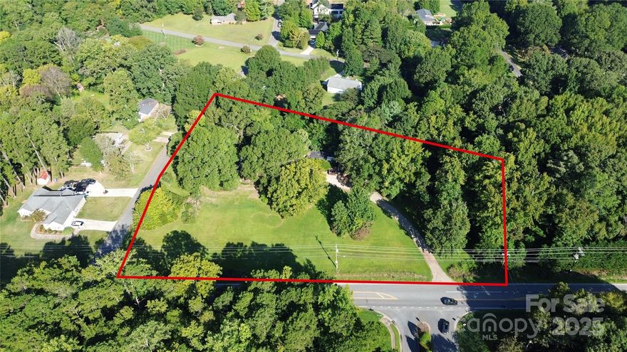 Rare find! A little over 3-acre lot available in Huntersville.  Located in a rapidly growing area at the corner of Shields Dr. and Mt Holly Huntersville Rd., this lot can be subdivided.  No HOA.  The home on the lot is being sold as is.  It does have city water available and a meter in place but is currently inactive, gas line in place for the water heater, roof and HVAC replaced in 2003.  Access to city sewer is available as well.  Great location – Only a few minutes from the Gar Creek Park Nature Preserve and the Pecan Ridge shopping center.  With easy access to 77 and 485, you’re less than 15 minutes to Birkdale, and 20 minutes to Lake Norman, uptown Charlotte, and the airport.  Build your dream home or two! Enjoy country living near the city.