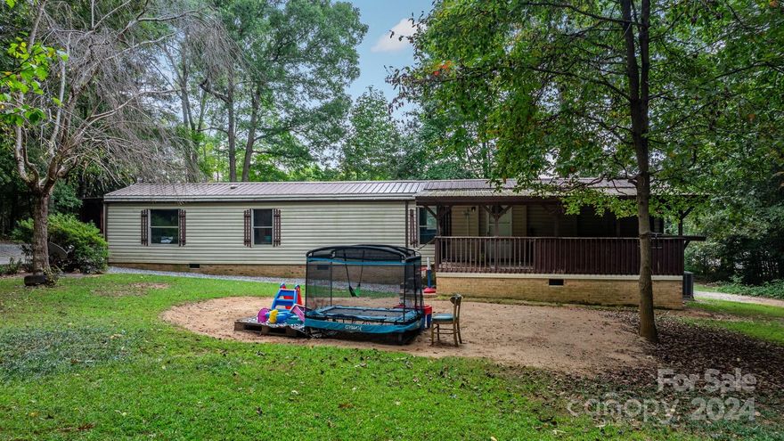 This spacious 2 bedroom, 2 bathroom home with several updates, on a privately located lot is a MUST SEE!! It has a beautiful finished sunroom with natural lighting throughout. All appliances stay at the property! Home is on 2.01 acres. Two car carport, as well as a single car carport. Outbuilding WITH POWER! New septic system will be installed prior to closing!!