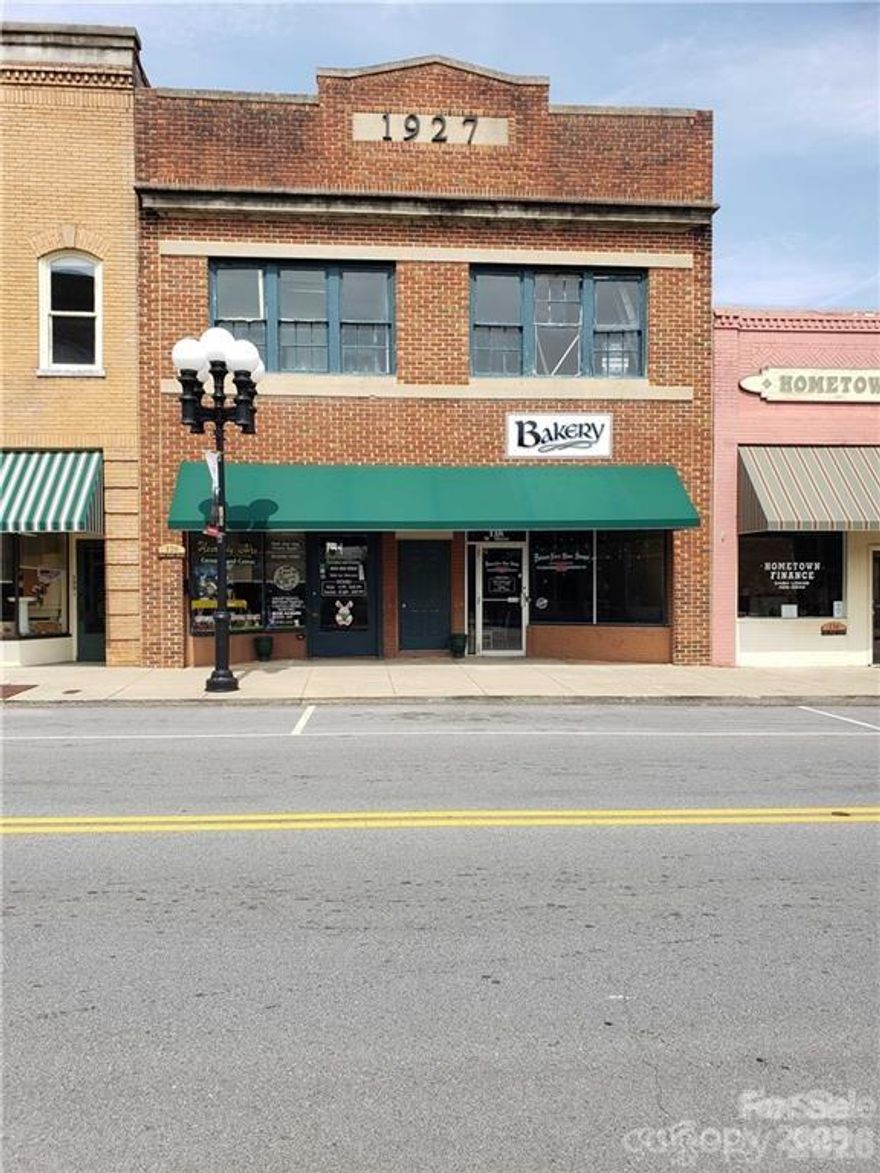 This is your opportunity to own a piece of Historic Main Street. Just looking at the finishes on the second floor you know this property at one time was a showstopper. Much of the original hardware is still intact. Property has 2 commercial spaces downstairs (approximately 1700 sq feet each). 1 ADA compliant bathroom. Some of the original brick has been exposed.