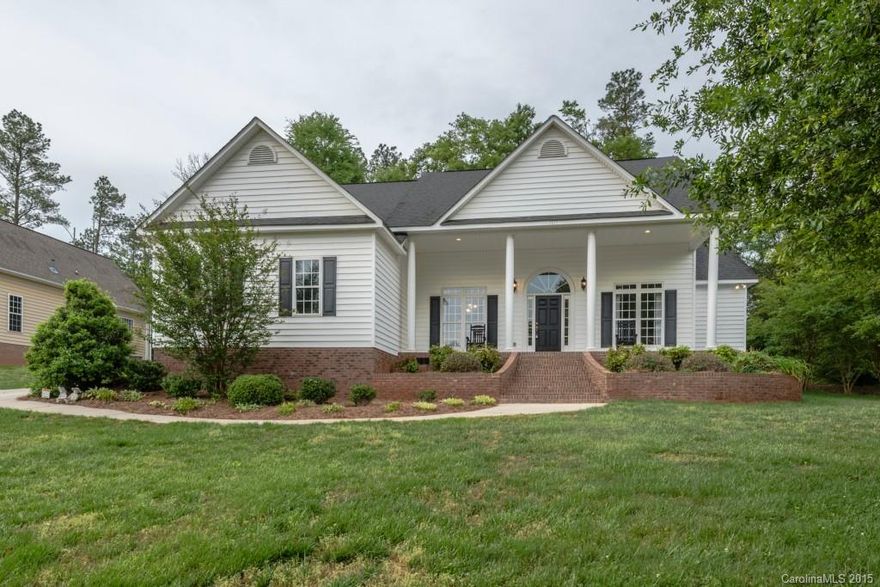 Sit back & relax on the large front porch of this custom built southern living plan. Open split floor plan with 12' ceilings, hardwood flooring and lots of windows add to the beauty of this home. Wide moldings, chair rails and wide baseboards are just some of the custom features. Bonus room upstairs makes a perfect play room or media room. Storage isn't a problem. Large walk-in attic could be another room. Private back patio. $5,000.00 upgrade allowance given w/ full loan approval.