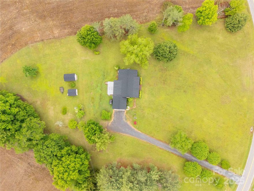 Charming One-Story Home on Nearly 3 Acres in Rich Hill Community! Nestled in the peaceful and sought-after Rich Hill Community of Lancaster, SC, this well-maintained one-story home offers the perfect blend of comfort, space, and country living. Situated on approximately 3 serene acres, this property features a cozy layout with updates throughout, a welcoming fireplace, and a spacious screened-in porch ideal for relaxing and enjoying the tranquil surroundings. Outside, you'll find two versatile outbuildings—a 12' x 20' and a 12' x 24'—perfect for storage, hobbies, or workshop use. With plenty of room to roam, garden, or simply unwind, this property is a rare opportunity to enjoy privacy and space while still being convenient to local amenities. Don’t miss your chance to own a slice of peaceful country living.