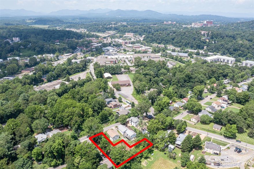 Sunny, cleared lot in the heart of Oakley zoned RM8, allowing for multiple units, *buyer to verify. This open parcel is minutes to downtown Asheville, moments to Biltmore Village, and all of the shopping and amenities of Hendersonville Road.