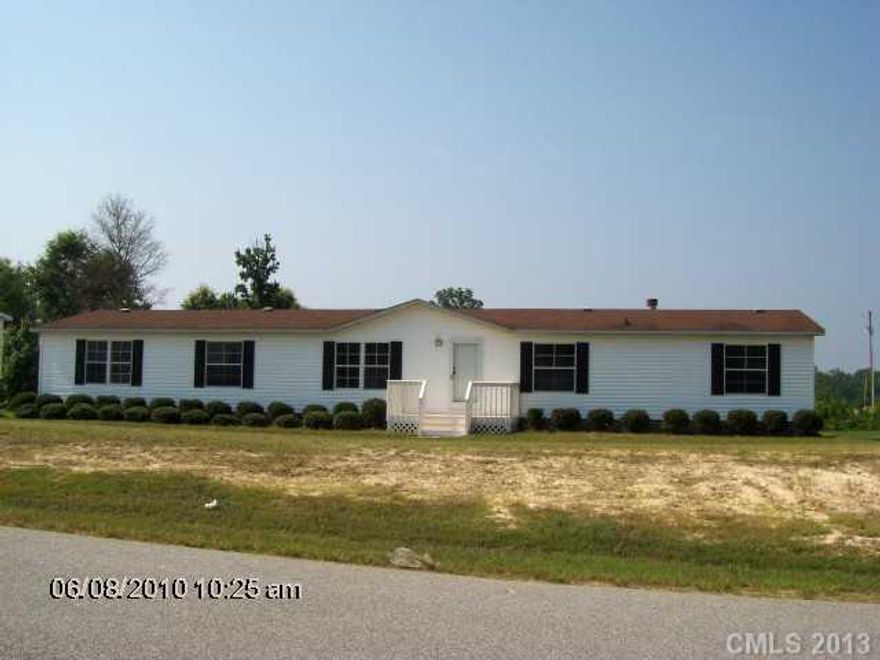 Big open space in this 4/2 bedroom home with office/den area in master bedroom. New tile in kitchen, new carpet in master, laminate flooring in den/living area. Freshly painted and ready to move in condition. You must see to appreciate the space.