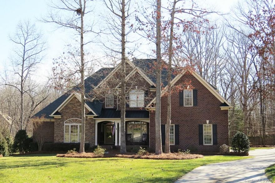 Gorgeous full brick and stone custom on 3/4 acre cul-de-sac lot in full brick community.  Spacious Owners retreat with luxury master bath.  Second bedroom/full bath on main level-perfect for in-law suite.  Gourmet kitchen with double ovens, large island with bar, eat in breakfast area, morning room and private screen porch.  Beautiful GR has fp, open staircase, two large bedrooms up each with private baths and lg bonus/bed room.  Site finished hardwoods, three car garage, irrigation system.
