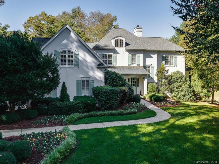 Elegant custom Simonini built French Country manor in private setting in desirable Oak Brook community. Just minutes to all schools, shopping and 485. Spacious floorplan with hardwoods, elegant moldings and custom cabinetry. Gourmet kitchen with large center island. Master on main. Three  additional bedrooms, bonus, loft and sitting room on second level. Covered porch and large terrace overlooks lush grounds and pasture. 3 stall shed row stable with tack and feed rooms.  Showings begin Tues 11/4