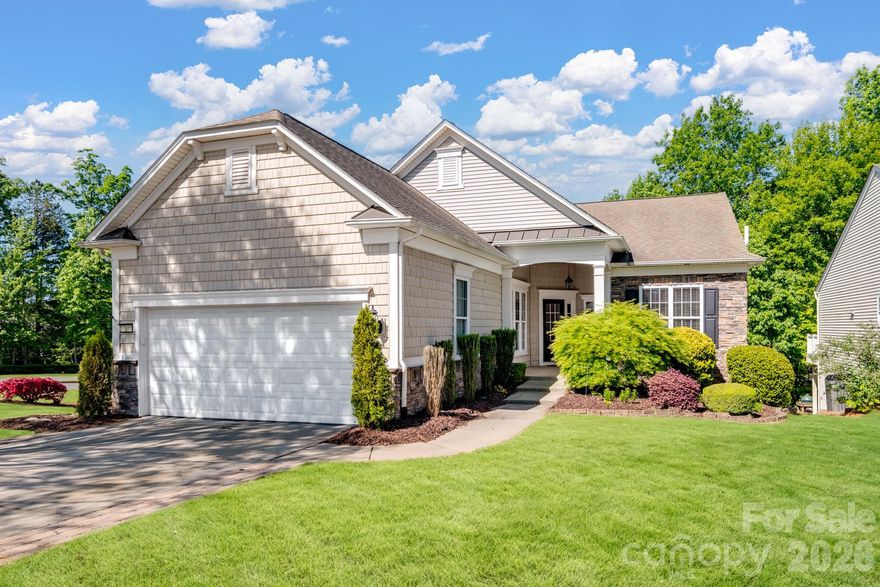 Be prepared to be impressed by this well-maintained Surrey Crest model with a finished walk-out basement, ideally situated on a desirable corner lot in Sun City Carolina Lakes.

A standout feature of this home is the fully equipped second living quarters in the walk-out basement, offering a private and versatile space complete with a full kitchen, bedroom, full bathroom, and separate living area, perfect for guests, multi-generational living, or extended stays.

The main level showcases beautiful hardwood flooring, while the basement features comfortable cork flooring, adding both style and functionality. This home also offers an extended garage and a thoughtfully designed layout with numerous upgrades throughout. Interior highlights include crown molding, tray ceilings, and a dedicated library with custom built-ins.

The kitchen is appointed with granite countertops, stainless steel appliances, and convenient cabinet roll-outs. Enjoy peaceful wooded views from the walk-out basement, creating a serene retreat.

Additional features include a water softener and fresh interior paint. The home is vacant, clean, and ready for immediate occupancy.

Located in the highly sought-after 55+ community of Sun City Carolina Lakes, residents enjoy a vibrant, resort-style lifestyle with access to golf, indoor and outdoor pools, fitness centers, tennis and pickleball courts, walking trails, and a full calendar of clubs, classes, and social events.