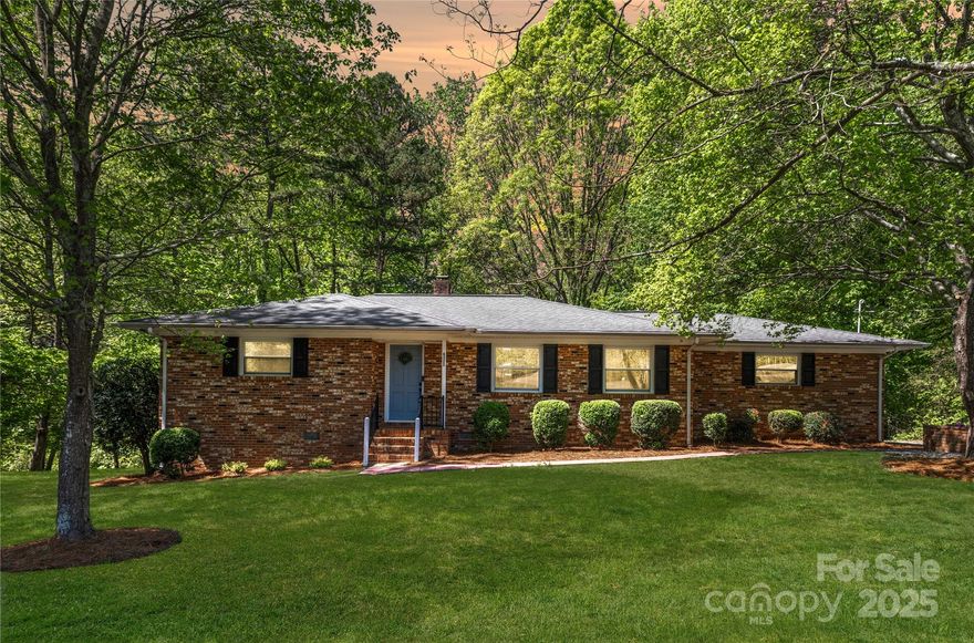 MULTIPLE OFFERS REC'D, BEST OFFERS BY 4/20 SUNDAY 8PM. Charming full-brick ranch-style home w/ finished basement! Featuring 3 bedrooms & 2 full bathrooms, this well-maintained property is move-in ready w/ numerous updates including newer vinyl windows, waterproof LVP flooring, lighting, ceiling fans, fresh paint, & landscaping! The main level boasts a spacious living room, open kitchen, & two bedrooms with a full bath. The finished basement features a large flex space, ideal for a second living area, office, gym, or creative space, along with a third bedroom, full bathroom, & private exterior access, offering potential for rental income or multi-generational living. Two mounted TVs will convey & the seller is including a 1-year home warranty for added peace of mind. The extended driveway provides plenty of parking & the large lot offers privacy. Conveniently located near shopping, dining, entertainment, Charlotte Airport, & major highways, this is an opportunity you won’t want to miss