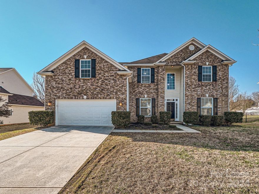 SECONDARY BEDROOM AND FULL BATH ON MAIN LEVEL. LVP flooring throughout both levels! Located in Brook Valley subdivision in Indian Trail, NC – walkable to all that Sun Valley Commons has to offer, from movie theater, restaurants and shopping to elementary, middle and high schools! This 5 BR + BONUS (or 6th bedroom—has closet!), 3 full bath home has close to 3000 s.f. Brook Valley subdivision has a community pool and playground! Desirable open concept floor plan has a large dining room and formal living room, and a spacious great room that is open to the kitchen. Kitchen features granite counter tops and stainless steel appliances. The secondary BR and full bath on main level is perfect for in-laws or a guest suite—or would make a great office! Five additional BRs are upstairs. Huge primary BR has trey ceiling, extra large walk-in closet, primary bath with separate garden tub and walk-in shower and separate vanities. Secondary BRs good-sized. Back yard is spacious and flat.