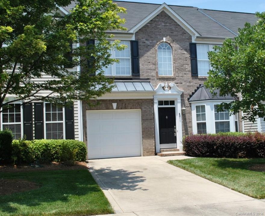 Beautiful townhouse w/hardwood floors throughout 1st floor, trey ceilings with custom cove lighting, new upgraded fixtures, blinds and carpet.  Dream kitchen includes granite counter tops with custom backsplash, new gas range with double oven, refrigerator, dishwasher and plenty of storage. Open floor plan includes sunroom opening to an inviting stone patio, enclosed for privacy, great for entertaining! This is the one you must see!