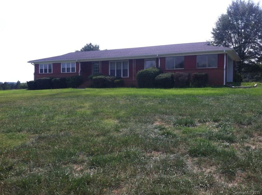 Beautiful all brick ranch, private pond and fenced pasture awaiting your livestock. Beautiful original hardwood floors in bedrooms and living room. Sunroom offers beautiful views of the surrounding pasture and large backyard.  Private pond surrounded by woodlands in pastured area. Double car shed and nice metal workshop also included. All the perks of country living minutes from Charlotte, Monroe and Concord. Natural gas pipeline crosses property in pasture area.