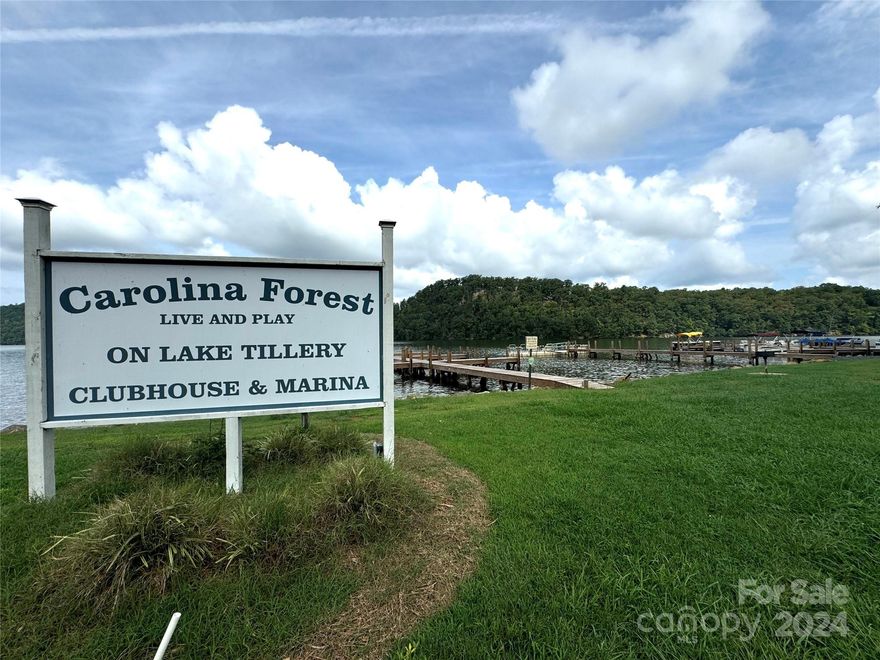 Escape to your perfect getaway near Lake Tillery! This stunning lot in the gated community of Carolina Forest offers an abundance of amenities for outdoor enthusiasts. Enjoy the many community amenities: saltwater pool, basketball court, tennis court, playground, trail, and clubhouse. With a community boat ramp and boat slips for lease (currently a waitlist), boating and fishing are just around the corner. Enjoy being surrounded by nature in this serene setting. Build your dream retreat and experience the best of forest and lake living! There is a quarterly water availability charge that the owner of the lot pays. Buyer pays $275 new owner set up at closing. Buyer will need to have the property evaluated by Montgomery County Environmental Health for a septic system - according to seller it had a current permit when they bought the property in 2006.