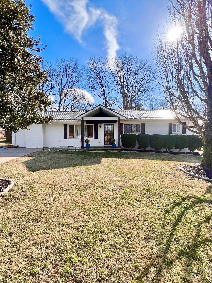 Wow! You do not want to miss out on this newly renovated ranch house in Valdese NC! There is a bonus room with a closet and half bath. (3 bedroom septic) Home was fully remodeled 2 years ago. In great condition. 
OUTSIDE- 2 YEAR OLD METAL ROOF, WHITE WASH BRICK FINISH, WOOD BARN SHUTTERS, NEWLY COVERED BACK DECK WITH CEILING FANS/LIGHTS/TV. 2 YEAR OLD WINDOWS. BRAND NEW 12X32 BUILDING, BRAND NEW PRIVACY FENCE IN THE BACK YARD.
INSIDE - 2 YEAR OLD FLOORS, 2 YEAR OLD PLUMBING IN PRIMARY BATHROOM, BLACK GRANITE COUNTERTOPS.

DISCLOSURE- This house was on the market a year ago, everything that was on the old inspection has been fixed. Only thing that was not fixed the septic tank sits half way under the back deck. The tank was inspected and cleaned, there were no cracks or damage from the tank being half way under the deck. Seller will not do anything with the septic tank for it is in great condition and working properly.