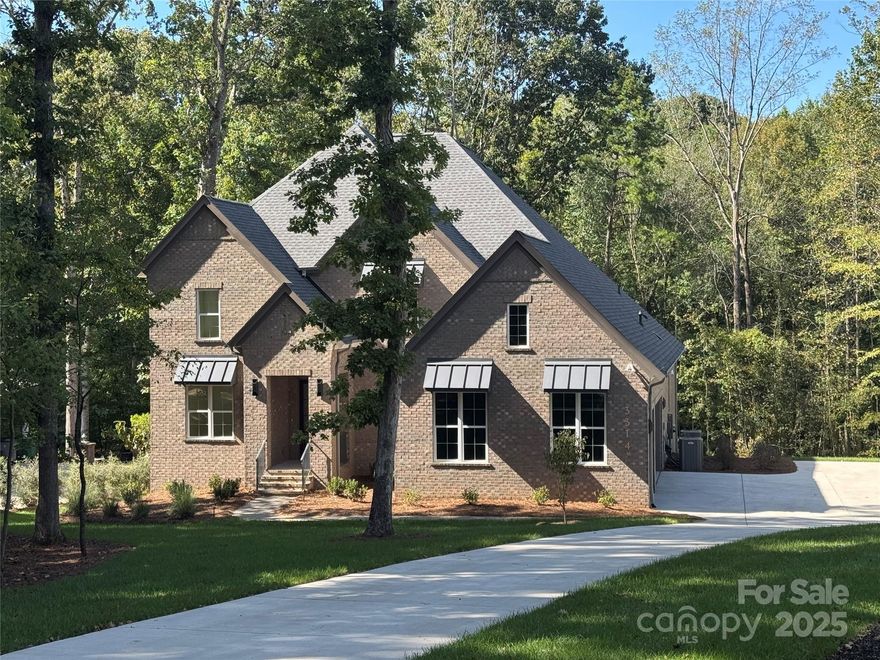 This one is sold but we have other homesites on Lakeside Drive.  Updated pricing to reflect actual home being built.  A rare opportunity in South Charlotte just off Providence Road - over 1 acre and wooded!  Enjoy an exceptional process free of surprises, know your final price before we ever break ground! See attached Starting Point Specifications listing all included features at the Starting Point price. Price sheet attached for land/home package including all site development and an extensive landscaping plan.