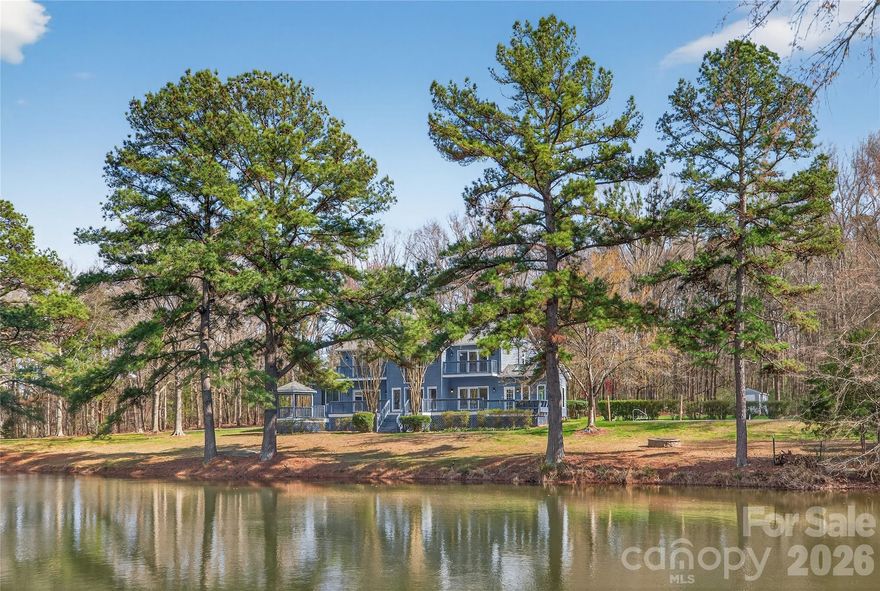 Rare opportunity to own a custom home on nearly 7 acres with no HOA just minutes from Charlotte. Properties with this kind of acreage, privacy, and natural views are becoming harder to find, especially this close to the city.

Built in the early 1990s and designed by a well-known local female architect, the home was planned to take advantage of the land, natural light, and surrounding views. With approximately 3,780 square feet, the layout offers generous spaces and a design that feels very different from typical subdivision homes.

The main living area features a two-story living room with large windows that bring in natural light and connect the interior with the surrounding landscape. The home includes 3 bedrooms, 2 full bathrooms, and 2 half bathrooms, offering both open gathering spaces and comfortable private areas.

The primary suite is oversized and includes its own fireplace, a large bathroom, and separate his-and-her closets. Just off the main living area, the sunroom overlooks the pool and backyard, creating a quiet place to sit and enjoy the view of the property.

A standout feature is the private office with its own exterior entrance and separate half bathroom, making it ideal for running a business from home, meeting clients privately, or creating a dedicated workspace.

Several important updates have already been completed, including new roof (2024), HVAC (2021), new windows, new gutters with gutter guards, and a new deck (2025). The home also offers an oversized garage and a large driveway with plenty of space for parking.

Outside, the property opens up to nearly 7 acres of land with an in-ground pool, a new deck for outdoor gatherings, and a stocked pond where turtles, blue herons, and otters are often seen. The setting offers a level of quiet and privacy that is increasingly difficult to find this close to Charlotte.

Homes offering this much land, privacy, and character in this location rarely come on the market. You really have to see it in person to appreciate the space, setting, and potential this property offers.