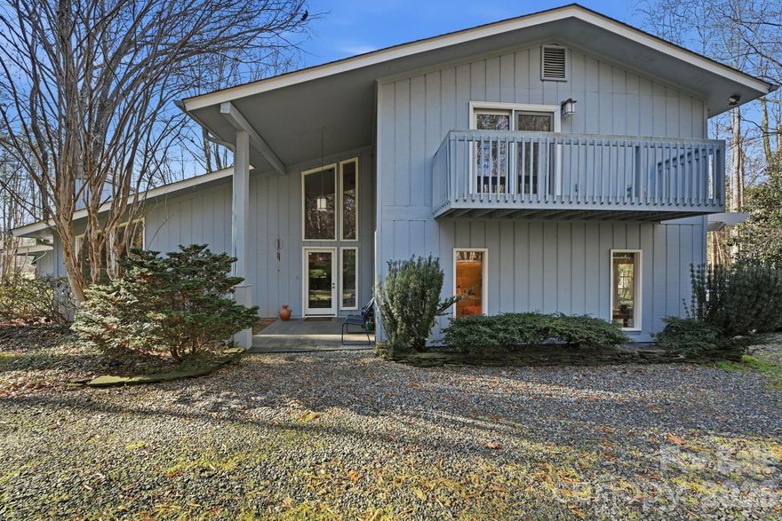 A unique opportunity to own an incredible mid-century modern home built in 1978 and brought up to more modern standards over the last 20 years. This 4-bedroom, 3.5 bath home with 2,700 SQ' of HLA is situation on a 2.89-acre lot that offers all the peace and tranquility one would expect to find in a rural setting while still being close to historic downtown and Davidson College. Bathed in natural light , the home has a wonderful guest suite on the main level while the spacious owner's retreat is located on the upper level with two other bedrooms. The majority of the house has engineered wood flooring and all the bathrooms have tile floors and shower surrounds. The main level welcomes the owners and guests into a vaulted living room with a wonderful gas fireplace. The cozy dining room is situated off the chef's kitchen which looks over the expansive backyard that is bordered by a creek that has recently been restored by Mecklenburg County's Environmental and Storm Water Service division. There is a large two-tiered deck off the rear of the house that is perfect for entertaining or quiet evenings enjoying the serenity of the large lot.  The property has its own private well and septic system that have both been well maintained along with the rest of the property.  The small red barn on the property has electricity and an upstairs loft that could be perfect for a studio. Don't miss out on this rare opportunity to own almost three acres so close to village center and other amenities. Welcome home.