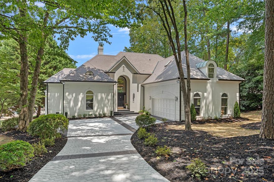 A hidden gem tucked away in the heart of Cornelius, this newly upgraded waterfront home in Waterford Point offers the perfect blend of Lake Norman luxury and convenience. The light-filled great room features gleaming hardwoods, soaring ceilings, built-ins, a gas fireplace, & sliding doors that open to your expansive back patio, saltwater pool/spa, and peaceful cove views. The chef’s kitchen impresses with quartz countertops, 6-burner Viking gas cooktop, double ovens, & a beverage fridge. The main-level primary suite boasts patio access, spa-style bath with soaking tub, oversized tiled shower, & custom walk-in closet. A private guest suite on the main adds flexibility, while upstairs offers a spacious bonus room and two guest rooms with a shared Jack-and-Jill bath. Shared floating dock for easy boat & paddleboard access as well as a community boat ramp. Conveniently located just minutes to dining, shopping, downtown Cornelius, and I-77.