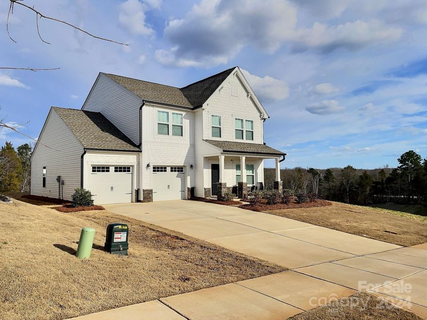Built in 2022, this 2-story home offers stunning and tranquil treetop views. Highlighting a front covered porch, four bedrooms, three and a half bathrooms with a spacious finished loft entertainment area for family and game day viewing! The first floor has a bedroom suite that can accommodate staircase-challenged residents. A spacious office at the front of the house behind French doors, as well as a convenient mudroom at the garage entry including a sizable bench, coat hooks and half closet.  Showcasing modern finishes, this home is perfect for anyone looking for a comfortable and stylish living space. The kitchen features a ten-foot island with like new stainless steel appliances, roll-out pantry shelves, and beautiful backyard canopy views. The spacious main bedroom includes a luxury bathroom with a modern dual sink vanity, separate garden tub and tile shower. Sizable guest rooms and a second-floor laundry room adds to the convenience and functionality of this delightful home.