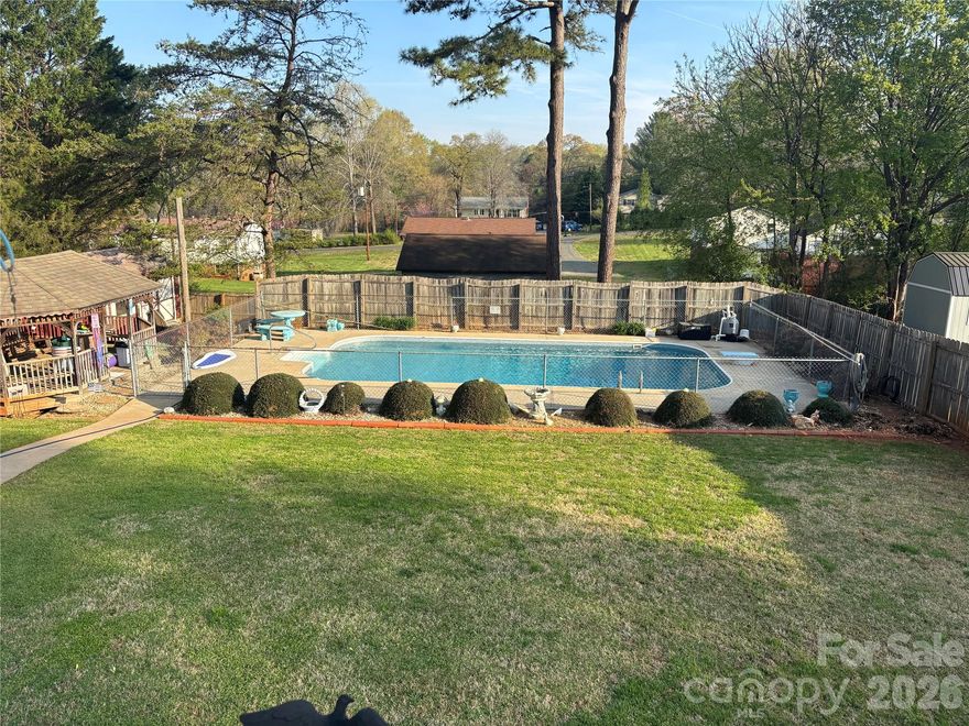 Charming One-Owner Split Level with Pool and Unique Backyard Oasis

Pride of ownership shows throughout this one-owner split-level home! Though the interior reflects its original era, it has been immaculately maintained and is ready for its next chapter. This 3-bedroom, 1-bath home offers a versatile layout and sits in an ideal location close to local conveniences and community amenities.

Step inside to find spacious living areas filled with natural light and endless potential for modern updates. The entry-level one-car garage can easily double as an enclosed outdoor space, perfect for entertaining or relaxing year-round.

Outside, discover a truly unique backyard designed for enjoyment and creativity — featuring a sparkling pool, a small bath house, and a separate storage building, all surrounded by mature landscaping that adds privacy and character.

The lower level includes a roll-up door for additional storage or workshop space, adding even more functionality to this well-loved home.

If you’re looking for a solid home with great bones, beautiful outdoor features, and room to make it your own, this is the one.