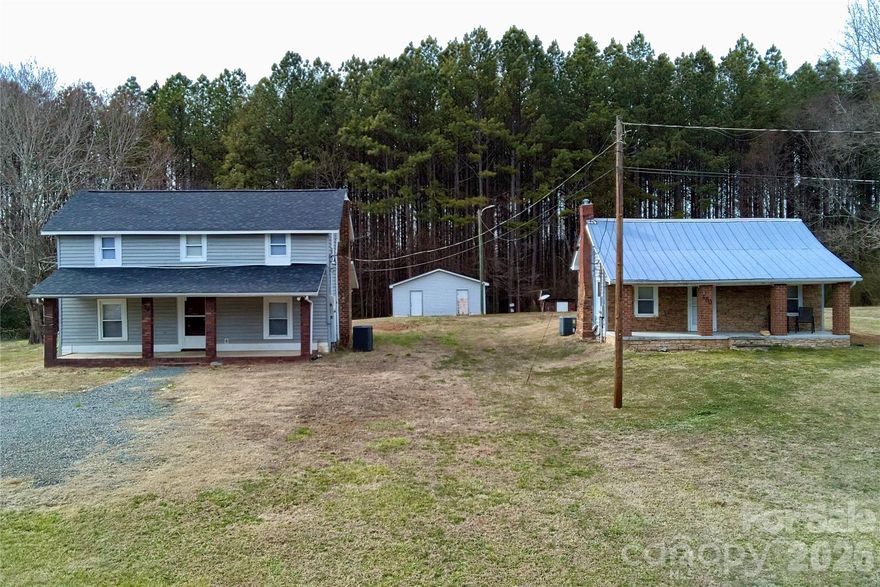 Rare income-producing opportunity — two structures, one price, 1.1 private acres. This beautifully restored 1900s farmhouse features a large covered front porch, back deck, and workshop/shed with electricity. The separate 1BR/1BA guest house carries a strong rental history with zero vacancy over four-plus years. Both units have been consistently leased below market rate, offering immediate rent upside for a new owner. Separate electric meters for each structure; shared well. New roof on primary home within the past year. Conveniently located between Concord and Mt. Pleasant with easy access to Hwy 49 and 73, and served by Mt. Pleasant schools. Sold as-is, priced to reflect renovation opportunity.