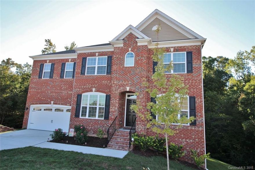 Simply elegant full brick beauty less than a year old!  Tastefully decorated and elegantly appointed with hardwood and tile floors, chef’s kitchen with all the fixins and a wonderful open plan with large rooms including a spacious owner’s retreat,  upgraded baths, a guest suite on the main plus a full framed and plumbed basement.  All this on a half acre wooded lot at the end of the cul-de-sac.