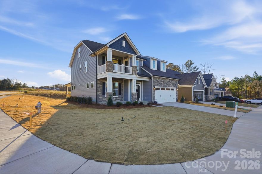 Welcome to new construction near the scenic Catawba River in Rock Hill! This stunning 3-story Cypress plan on a corner lot offers 4 beds, 4 baths & more than 2,800 square feet of living space. When you walk in you are greeted by an office complete with French doors and wainscoting. Enjoy the designer kitchen featuring a large island, white cabinets, quartz countertops, tile backsplash, stainless range hood & appliances. The inviting family room features a traditional gas fireplace with slate surround. The main level offers a guest bedroom and bathroom with tiled shower and bench seat. The primary suite on the second level includes a sitting room & bathroom with a luxury shower, two separate vanities, and a linen cabinet. The upper level also has a full bath, large loft that walks out to the balcony, and convenient laundry room. That's not all! The home offers a large 3rd-floor bedroom and full bath. The rear of the home features a covered porch, paver patio, firepit, and seating wall. Visit today!