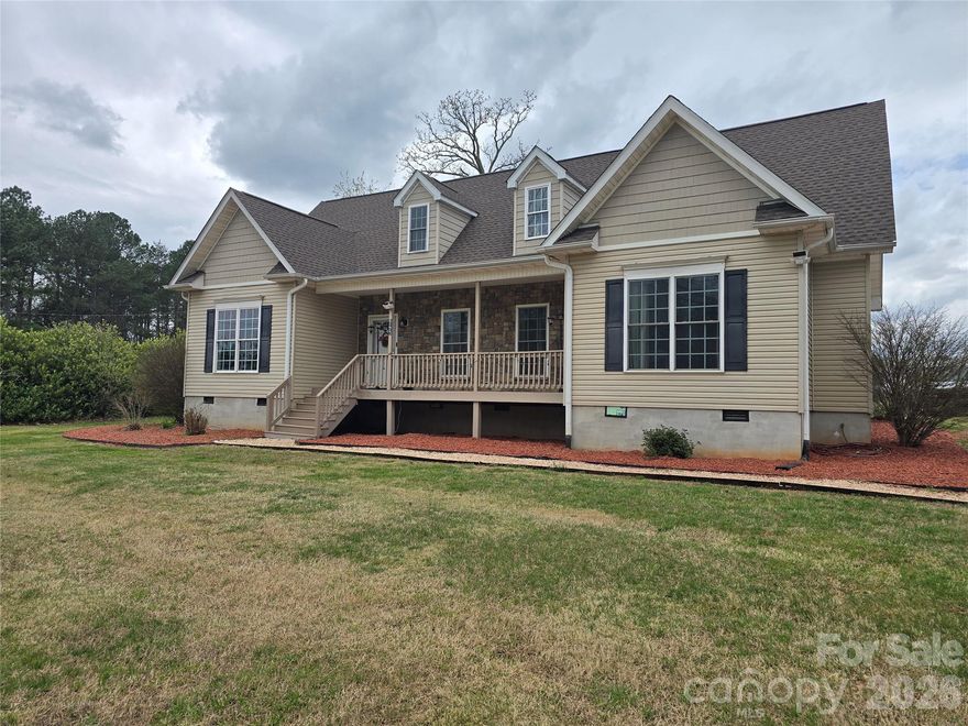 Set on approximately 1.52 acres with a level lot, this modular home offers a functional layout and multiple living spaces. The main level features a primary bedroom with an ensuite bathroom, two additional bedrooms, a full bathroom, and a convenient laundry area. The kitchen opens to the living room with a fireplace, along with a dedicated dining room. Outdoor living includes a back deck and a spacious covered front porch. The second floor has been finished and provides flexible space suitable for a recreation room, theatre room, or additional living area. The property also includes a fenced yard and new carpet throughout much of the home. Turn Key home ready to make your own!