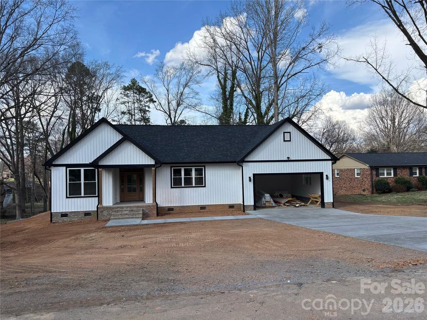 This beautiful new construction home in Cherryville, NC is a must-see! Step inside and immediately feel the comfort and openness of the thoughtfully designed open-concept floor plan, offering seamless flow between the living, dining, and kitchen areas—perfect for everyday living and entertaining. The kitchen is truly the center of the home, featuring elegant quartz countertops, a large gathering island, and stylish finishes that make cooking and hosting a joy. Beautiful flooring runs throughout the home, adding both durability and modern appeal. This spacious 3-bedroom, 2-bath home offers generous living areas and ample closet space. Step outside to the large covered back porch—ideal for morning coffee, relaxing evenings, or hosting friends and family. The two car garage is perfect for keeping your cars protected from the weather. Conveniently located near Cherryville, Shelby, Lincolnton, this home combines comfort with accessibility. Don’t miss the opportunity to add your personal touch—buyers under contract prior to completion may have the option to select paint colors. Completion date should be early April.