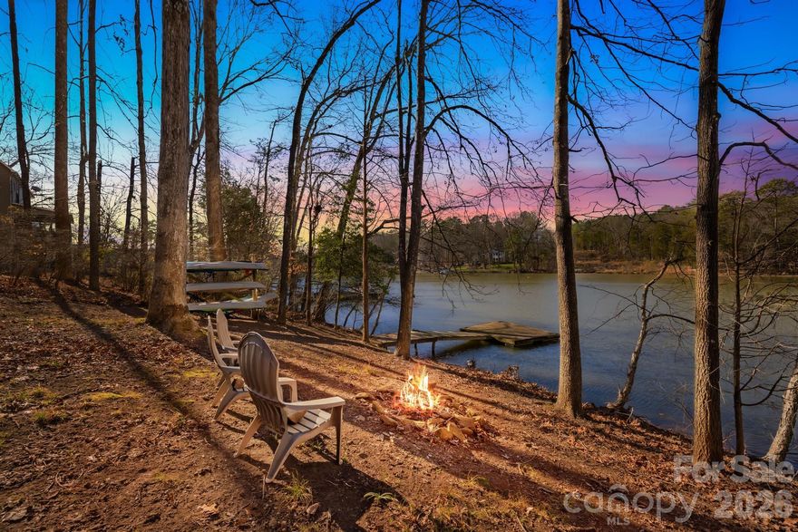 Come view this Rare Lake Wylie waterfront retreat, where timeless log-cabin construction meets refined upgrades on a private 0.92-acre estate with over 200 feet of shoreline. Offering AirBnB flexibility, this property presents an exceptional opportunity for luxury living, a second-home escape, or a high-end income-producing asset...

Inside, the home is warm yet sophisticated, featuring original hardwood floors, dramatic skylights, and an open-concept living space anchored by a wood-burning fireplace that creates an inviting, elevated atmosphere. The designer kitchen is thoughtfully updated with new granite countertops, slate tile flooring, stainless steel appliances, a farmhouse sink, and an enhanced water filtration system, blending elegance with everyday practicality.

The expansive great room flows effortlessly onto a screened porch and lake-view deck, offering a seamless indoor-outdoor experience ideal for upscale entertaining or tranquil mornings overlooking the water. Outdoors, enjoy your private dock, with approximately 6 feet of water depth at full pond and planned dredging, providing reliable access for boating, paddle sports, and sunset cruises.

The primary suite serves as a serene retreat with dual closets, while two additional bedrooms and a stylishly updated bath accommodate guests with comfort and refinement. The surrounding grounds offer ample space for fire pits, lounging areas, hammocks, and curated outdoor amenities, creating a resort-like setting.

Additional features include an approximately 800-square-foot unfinished basement, offering substantial storage or future expansion potential. Recent upgrades further enhance value and peace of mind, including a NEW roof, NEW septic tank and pump, fresh paint, updated lighting, and a modernized water filtration system.  
-  (Right around the corner is Papa Doc's, Starbucks, Planet Fitness & so much more off Charlotte Hwy (HWY 49) heading into Lake Wylie. )   **

This is more than a home; It’s a private waterfront sanctuary delivering luxury, flexibility, and enduring Lake Wylie appeal.** PS-Very private cove and community!