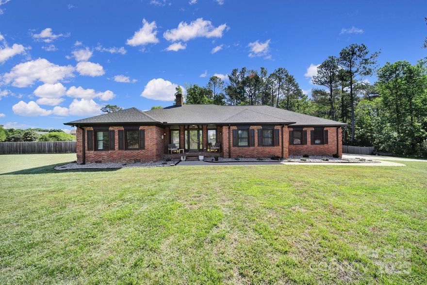 BACK ON MARKET after being on the market for 9 hours! 
Tucked away on approximately 4.18 acres of both open and wooded land, this custom brick ranch offers space, privacy, and thoughtful updates throughout.  Inside, you'll find a warm and welcoming layout with a sunken den, formal dining room, study, and an inviting eat-in kitchen—all updated with refreshed flooring and modern finishes. The split-bedroom floor plan adds a sense of privacy, with the spacious primary suite located just off the kitchen. The remodeled en-suite bath is a true retreat, complete with a spacious tiled shower and separate soaking tub for relaxing at the end of the day. An attached two-car garage and a separate one-car garage/workshop provide plenty of room for vehicles, hobbies, or storage. Don't wait - schedule your private tour today!