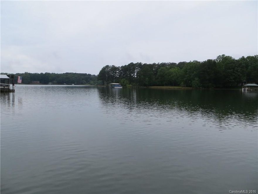 FANTASTIC WATERFRONT LOCATION! DEEP WATER IN A WIDE OPEN COVE, RIGHT OFF OF THE MAIN CHANNEL. 159 FEET ON THE WATER. FLOATING DOCK AND PIER IN PLACE. GRANDFATHERED USABLE BOAT RAMP. NICE WEEKEND HOME WITH 2 BEDROOMS OR YOU COULD BUILD YOUR OWN HOME AS THIS IS A WONDERFUL LOT WITH GREAT VIEWS! MASTER BEDROOM ON THE MAIN ALONG WITH THE GREAT ROOM, KITCHEN, LAUNDRY, 2 FULL BATHROOMS AND SITTING/SUNROOM. 2ND LEVEL FEATURES BEDROOM WITH 1/2 BATHROOM AND WALK OUT STORAGE. DECK OFF OF THE BACK.