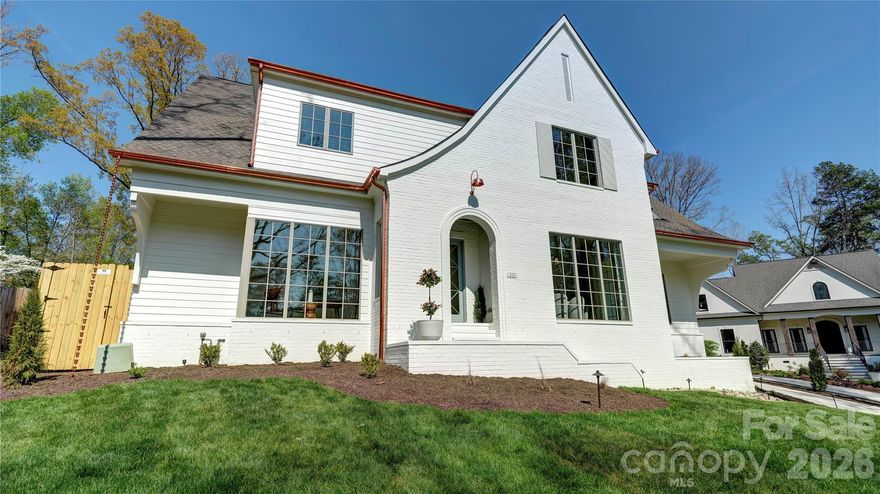 Welcome to this exceptional new construction home by Springdale Custom Builders, thoughtfully positioned at the end of Hunter Lane in Sherwood Forest - one of South Charlotte’s most established and sought-after neighborhoods. Offering convenient access to Uptown, SouthPark, South Charlotte, and the region’s premier hospital systems, this residence pairs location with an uncompromising level of design and craftsmanship.

Set on a private lot, this 4,798+ square foot home is a showcase of refined living, where every element has been intentionally selected and meticulously executed. From the moment you arrive, the architectural presence is undeniable, highlighted by copper gutters, a custom rain chain, designer copper lighting, and custom oversized corbels - distinctive exterior details that signal the level of quality carried throughout the home.

Inside, the layout is both highly functional and beautifully composed, designed to support everyday living while elevating the experience of entertaining. The home features five bedrooms, four full bathrooms, and a powder room, along with a dedicated office, screened-in porch, and a spacious recreation room with wet bar. Each space flows naturally into the next, creating a cohesive and comfortable environment.

At the heart of the home, the kitchen is as practical as it is striking - anchored by an oversized island and complemented by a decorative slab backsplash that creates a clean, elevated focal point. A fully equipped scullery and butler’s pantry provide additional function, with the scullery featuring a second dishwasher, full-size refrigerator, and a large fluted farmhouse sink - ideal for seamless entertaining. Custom cabinetry is thoughtfully integrated throughout the home, paired with detailed millwork that adds depth and character. In the kitchen, scullery, and butler’s pantry, brass cabinet hardware sourced from England introduces a refined, bespoke finish.

Site-finished oak hardwood floors extend throughout, reinforcing the home’s warmth and craftsmanship. The open-concept living area centers around a limestone-surround fireplace with custom built-ins and picture lighting, creating a refined focal point while maintaining a relaxed, livable feel. Large openings lead seamlessly to the screened-in porch, where a dedicated fireplace creates an inviting, year-round outdoor living space.

The dining room and private office are positioned for both functionality and visual impact, each featuring dramatic 8-foot windows that extend to the floor, filling the spaces with natural light and enhancing the home’s architectural presence.

The main-level primary suite is designed as a true retreat, offering privacy, scale, and thoughtful detail. Vaulted ceilings create an airy, elevated feel, while the ensuite bath features custom cabinetry with reeded doors and drawers, bringing a tailored, furniture-quality aesthetic. A zero-entry walk-in shower with a striking tile design completes the space, delivering both luxury and ease of use.

Upstairs, four additional bedrooms and three full bathrooms provide ample space for family and guests. Each bathroom has been individually designed with unique, high-end finishes - ensuring that no space feels secondary. An oversized bonus room offers exceptional flexibility, easily functioning as a media room, fitness space, additional bedroom, second office, or creative studio, complete with a wet bar to support any use.

Every detail of this home reflects Springdale Custom Builders’ commitment to quality, design integrity, and livability. This is not simply a new construction home - it’s a carefully curated living experience in one of Charlotte’s most desirable locations.

Showings begin March 28.