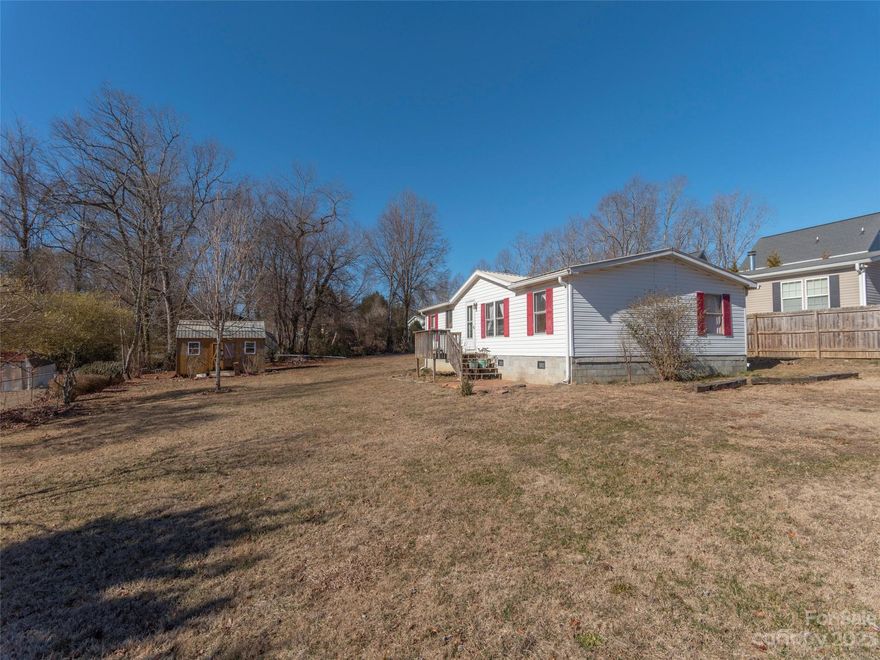 Unlock the potential at 58 and 60 Goldmont Street in the heart of Black Mountain! This double lot, perfectly situated, invites you to join a fantastic community and enjoy a brief stroll to the serene Lake Tomahawk and the bustling downtown. A hidden gem awaits with a doublewide on the lots, ready for a TLC transformation. Imagine the possibilities-construct your dream home, split the lots for two unique residences, or revive the doublewide while adding another home beside it. This is your chance to shape a new chapter in the desirable Black Mountain locale. Embrace the charm, create your haven, and make it yours! More pictures coming soon. Please use rear entrance, front steps are broken.