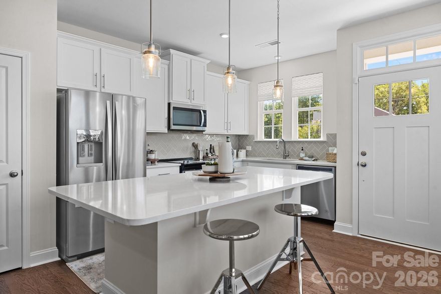 Welcome to Odell Park Premier Townhomes Offering the Most Convenient Access to Regional Commuter Routes and Concord Mills. Our Rochester plan features 3BR / 2.5BA  with a 1-car garage offering modern design and practical spaces just minutes to I-485 , Highland Creek, and Concord Mills Blvd. The main level features an open-concept layout with luxury vinyl plank flooring. The kitchen includes quartz countertops, stainless steel appliances, a spacious island, and an approximately 12' deep finished storage closet—ideal for pantry or utility use. A bright dining area and connected family room make the space inviting for both daily living and entertaining. Upstairs, the Rochester plan offers three bedrooms, two full baths, and a convenient laundry closet. The primary bedroom and bathroom highlight a 5' tiled shower, dual vanities, and a large walk-in closet. Secondary bedrooms provide flexibility for work-from-home, guests, or hobbies. Odell Park offers quick access to  shopping, dining, parks, major highways, UNC Charlotte, and local employment centers. HOA services cover water, trash removal, lawn care, and landscaping, supporting a low-maintenance lifestyle in a convenient Charlotte location. This home is under construction and scheduled to be completed by the end of March/ Beginning of April 2026 giving buyers the opportunity to plan ahead and secure new construction at today’s pricing.