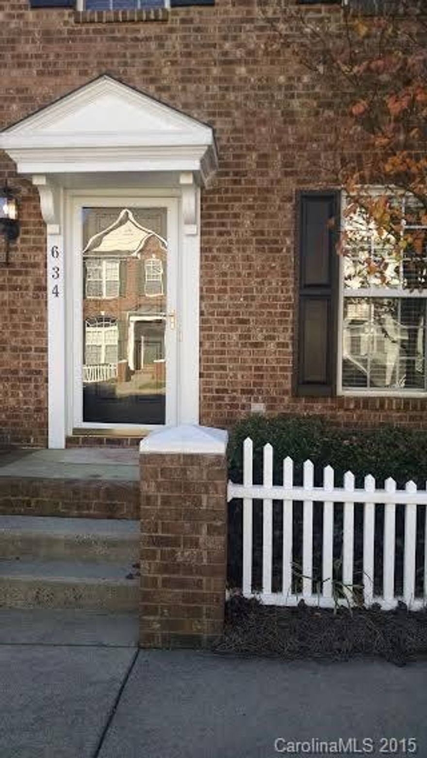 Totally updated condo in convenient location.  Minutes from I-77 and shopping.  Beautiful wide board laminate floors, Merillat kitchen cabinets, new flat top stove, stainless microwave and dishwasher and granite countertops, tile backsplash in kitchen,  wall to wall carpeting and tile floors. All freshly painted.  Large sunny great room with patio doors to patio and rear parking with storage shed. Lots of closets and pool and club house for the community.