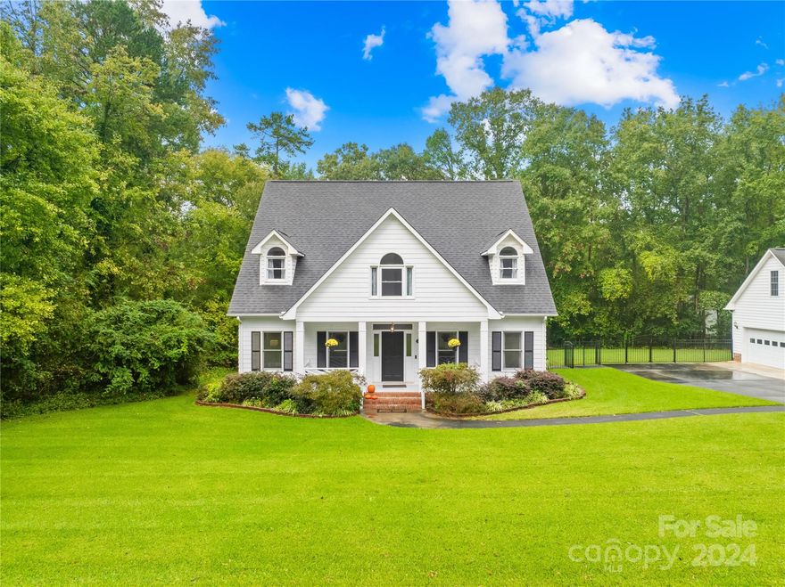 Welcome to the tranquil setting of this country charmer! You will feel like you're living in the country, but be just minutes from shopping and entertainment. Retreat to the main level primary suite featuring an ensuite bathroom and generous closet space. Three additional bedrooms upstairs provide room for family, guests, or a home office. Upstairs bathrooms have been newly renovated. Many upgrades have already been done including new flooring throughout, fresh paint, and kitchen countertops to name a few. Step outside to a lovely backyard, equipped with an in-ground pool and space that's perfect for summer barbecues or quiet evenings under the stars. Situated on 1.37 acres with no HOA, surrounded by lush greenery and mature trees, the expansive yard provides a serene escape from the hustle and bustle of daily life. Plenty of parking space available with a detached two car garage. Additional storage building is perfect for your yard and pool equipment.