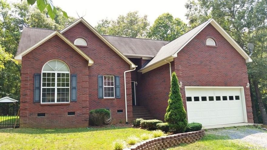 Cozy brick ranch hidden from the road via easement on 5 ac. Cathedral ceiling family rm open to breakfast-kitchen w/double corner windows, tile countertops & backsplash, recessed & pendant lighting, access to deck & screened porch, tray ceiling in master, bead-board style wainscoting in hallway, generator backup system, water filtration system, separate purification faucet at kitchen sink, heat/cooled 400 sq.ft. building w/tile floors, porch. No known problems but selling "AS IS".