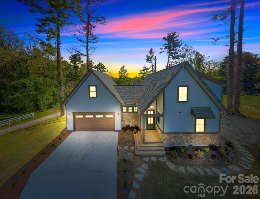 Set in the historic Lake Osceola area just minutes from downtown Hendersonville, this 3-bedroom, 2.5-bath, 1,812 sq ft home reflects the kind of quiet, methodical building that holds up over time. Lake Osceola — one of the defining features of this part of town — is in full view from the property, anchoring a setting that has been quietly established for generations.
Inside, the difference is felt before it is seen. Solid oak hardwood floors run underfoot with the depth, tone, and longevity that only real wood delivers. Interior doors are 8-foot solid-core throughout, weighted to close with the soft authority of a true custom home — they dampen sound, hold their alignment over time, and carry an understated presence from room to room. Pella Impervia fiberglass windows, engineered for long-term durability and built to outperform vinyl and clad-wood alternatives in mountain climates, frame the views without the maintenance demands of lesser units. Natural stone accents bring texture, depth, and permanence — the kind of material choices that age into a home rather than out of it.
Outdoor living was built in, not added on. The rear covered deck extends the home's footprint into the open air, offering a sheltered space for morning coffee, evening conversation, or a quiet view of the lake across every season Western North Carolina has to offer. The garage is fully insulated with an insulated overhead door — a small detail that pays back every day in lower energy loss, quieter operation, and a workspace that stays usable year-round, whether you're storing seasonal gear, working on a project, or simply parking out of the weather.
The location does the rest. Hendersonville's historic downtown — its independent shops, restaurants, galleries, weekend markets, and Main Street character — is only a short drive away, while the home itself sits on a quiet street in one of the city's most enduring neighborhoods. The Blue Ridge Parkway, DuPont State Forest, Pisgah National Forest, and the broader Western North Carolina mountain region are all within easy reach.
This is a home for the buyer who reads spec sheets, opens cabinet doors, and runs a hand along the trim — and recognizes the difference. Schedule a private showing and see the craftsmanship in person.