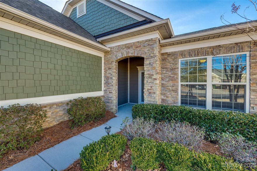 Welcome to this lovely ranch in the popular Carolina Orchards 55+ community.  This spacious 2 bedroom, 2 bath home has been meticulously maintained and is move-in ready with fresh paint and boasting hardwoods throughout. Primary bedroom has an oversized walk in closet with closet organizer.  Kitchen is light and bright with granite counter tops, oversized kitchen island, stainless appliances and gas cooktop as well as additional built in counter and cabinet space with beverage/wine fridge.  Open floor plan with gas fireplace in living room, eat-in dining area and bright sunroom lead to a large fully screened porch, paver patio and a landscaped and fenced backyard. You don't want to miss this one! Close proximity to 77, Baxter Village, Kingsley and RiverWalk.  Amenity rich community includes: lawn maintenance, clubhouse, dog park, indoor and outdoor pool, work out facility, 2 lit bocce ball courts, 4 tennis courts, 8 pickleball courts and too many social events to name and LOW SC taxes!