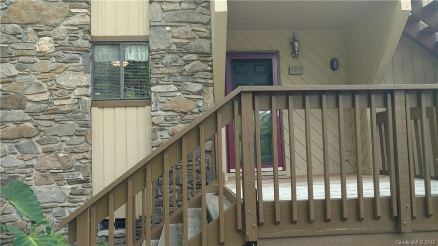 South Asheville. Wonderful location close to everything.  Large, open, light-filled first floor end unit with wooded view off back covered deck.  Side covered porch with modified handicap access ramp.  Lots of storage space; exterior front storage closet, and spacious storage room off back deck.  Large master suite, and newer wooden front porch/deck about one year old.  Rental cap. No pending special assessments.  HOA monthly dues, with garbage included.