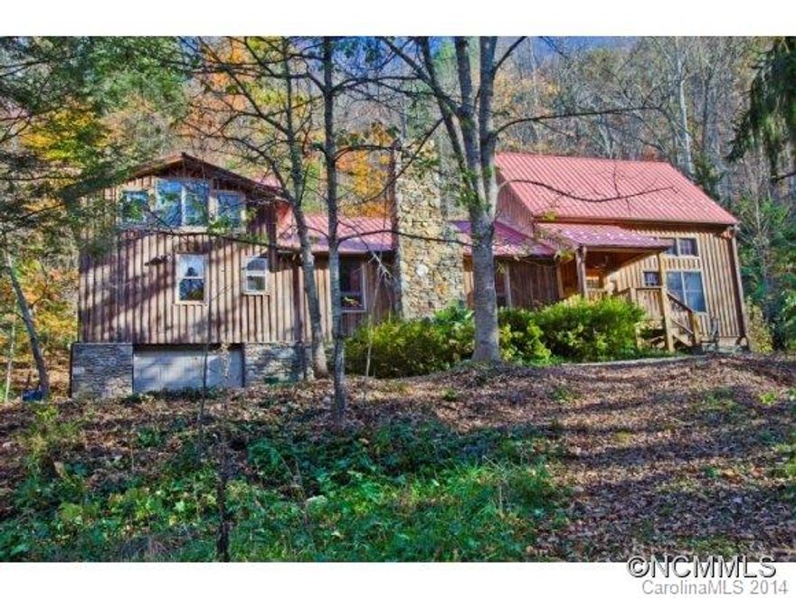 Priced at Appraisal!! Rare opportunity to own a private estate only 15 mins from Asheville! End of road privacy on 55 acres(Shinn Gardens to wildflower enthusiasts!). Impressive Timberpeg addition with 23' high ceilings and 2nd level library. Finished,heated attic studio not included(281sf). Lower ceilings in orig. portion,basement and garage. Newer detached studio/workshop 1132sf offers great potential. Cypress siding exterior,see Virtual tour