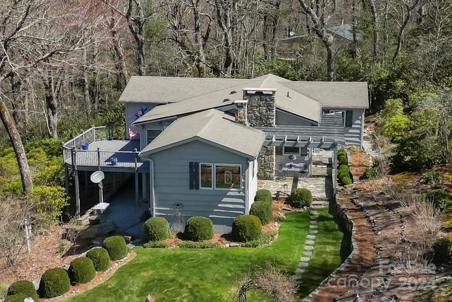 Lovingly furnished, beautifully landscaped, and meticulously maintained 3BR/2BA mountain cottage in Gingercake Acres on 2.45 acres. Handed down from one generation to the next, this home has all the mountain charm you've been looking for! Warm details include wood floors, pine walls, tongue & groove vaulted/beamed ceilings, stone fireplace, and pine kitchen with solid surface counters. Enjoy the cool mountain air at approximately 3700 ft elevation on the stone patio and trex deck. To be sold with all furnishings. Duel fuel heat pump/propane gas furnace for heat and A/C. Small basement storage area under sunroom. See pictures for floor plan and how very close you are to adventures at Hawksbill, Table Rock, and the Linville Gorge! Join Gingercake Recreation Club for access to pool, clubhouse, tennis/pickle ball, horseshoes, playground.