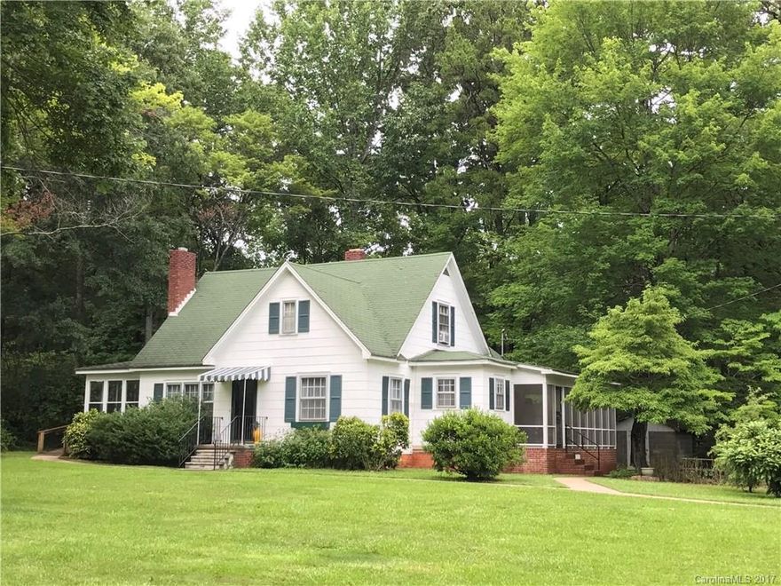 Relax on large screened porch of this charming one owner home on 5 ac with mature vineyard. LR frpl. HW flrs under carpet in LR/DR per seller. HW flrs in 3 main flr BRs (one with huge walk-in closet). Built-in dining in kitchen. Heat pump serves downstairs (all but sunroom) and full bath up. Upstairs also has 2 rooms with window unit a/c, and one has a large walk-in closet (no heat, so this approx. 433 sq.ft. not in HLA). Septic tank for 4BR home. Home Warranty. Catawba Land Conservancy at rear!