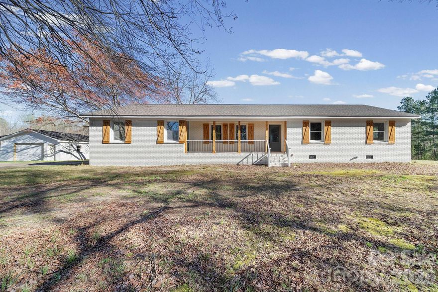 Enjoy country living in this beautifully renovated 3-bedroom, 2-bath all-brick home set on 9+ private acres surrounded by mature oak and magnolia trees. A gated driveway welcomes you to the property, offering both privacy and charm. Inside, the home features a spacious open floor plan with a dedicated laundry room and a well-appointed kitchen with accent lighting and granite countertops. The owner’s suite includes a private bath with shower and a walk-in closet for added comfort. Outside, the property offers rear screened porch for morning coffee.  And plenty of room for hobbies, storage, or business use with a 24x40 workshop and an additional 20x24 outbuilding. This property combines modern updates with quiet country space—perfect for those seeking privacy, room to roam, and functional outbuildings. BUFORD SCHOOLS AND NO HOA!