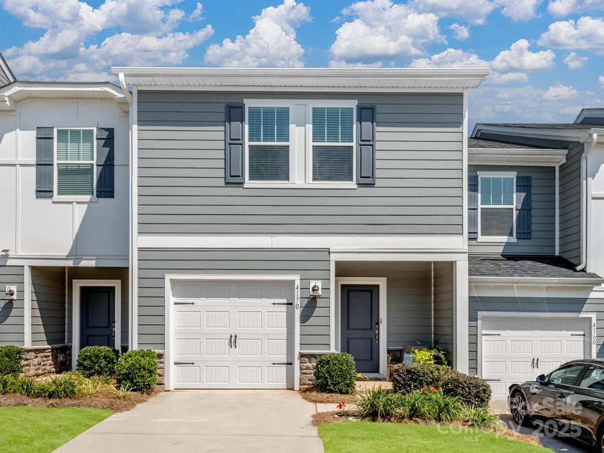 SELLER LOVES THIS HOUSE and moving because of employment relocation.  Only 2.5 yrs old! Energy-efficient, smart townhome is clean & open, yet warm & updated due to additional touches made. Cute covered front porch, bright kitchen, energy-efficient appliances, quartz counters, sliding doors leading to a patio with no backyard neighbor homes in view! White vinyl privacy fence on one side belongs to neighbor and installed by the builder. Enjoy the luxury of low-maintenance living while your HOA handles the dirty work! Upstairs has 3 beds, 2 full baths (1 has a tub), AND a spacious LOFT! Separate laundry room so you don't have to sort clothes in the hallway or kitchen. Primary bedroom has walk-in closet, tiled walk-in shower and water closet. Best of all, you'll be acquiring value of being at the beginning of the upcoming "community of convenience", an exciting retail development (see attached plans). Lowe's Foods opening spring '26. Easy access to I-85, Charlotte, Harrisburg, Huntersville & Salisbury. Seller open to giving concessions for buyer closing costs.