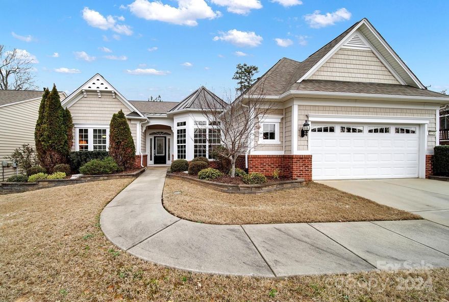 Cumberland Hall w/ a 3-season room + on the golf course! Lovely curb appeal w/ the partial brick exterior & front garden beds. Neutral paint, elegant crown molding, tons of natural light, & prefinished wood flooring in the main living areas! The chef's kitchen boasts granite counters, SS appliances, gas cooktop, wall oven & microwave, long & spacious island, double door pantry, & a sunny breakfast nook! Cozy up to the gas-log fireplace in the great room during the cooler months & enjoy the spacious 3-season room w/ tile flooring while watching the golfers! The primary suite has a tray ceiling & a bathroom w/ a soaking tub, dual sink vanity, glass shower, & a walk-in closet! 2 guest bedrooms w/ a Jack-and-Jill bathroom are perfect for overnight guests. There is also an office/den w/ French doors- ideal for working from home or to use as a hobby room! The rear paver patio is a great spot to relax, grill out, & host friends & family! Join the active-adult lifestyle in Sun City today!