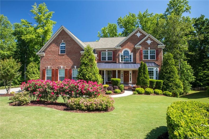 Absolutely stunning 2-story home sitting on approx 1/2 acre in a quiet cul-de-sac. This home backs up to a green area, has upgrades galore, and features: 5 bedrooms; 4 full bathrooms; Large gourmet kitchen; Formal dining room; Living room w/fireplace & coffered ceiling; Den w/adjacent full bath could be 6th BR; Large BR w/private bath on main perfect for in law suite; Dual staircase; Huge master w/gorgeous master bath; Bonus room w/wet bar; and a 3 car garage. Highly ranked Clover schools!