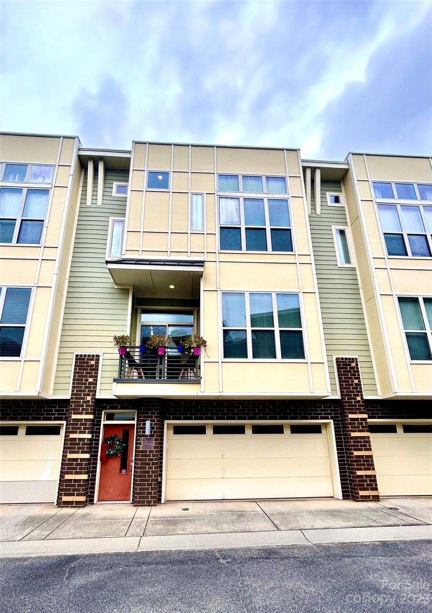 Beautiful modern townhome with garage in NoDa's Steel Gardens complex. Great location beside North Charlotte Park and easy walk to shopping, dining, nightlife & light-rail in the heart of the neighborhood. Open and bright floorplan with gourmet cooks kitchen (check out that upgrade gas range) with large island. Balcony off the living room and very private fenced back yard area. Large 2-car garage with space for your workshop and extra storage under the stairs that lead to the main living areas. New flooring (carpet removed) upstairs in the hallway and bedrooms, and check out those soaring vaulted ceilings and extra windows. HOA dues include high speed internet, cable, water, master insurance. Home is in great shape, no updates needed, your buyers can just move in and hang their artwork and clothes!