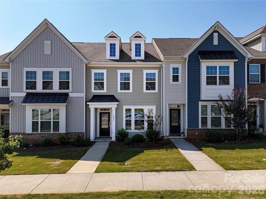 Welcome home to this beautifully maintained townhome in the highly desirable Chateau community! Built in 2022 this two-story townhome combines modern design with a warm, welcoming atmosphere that’s perfect for today’s active lifestyle. Step inside to a bright, open-concept main level where the living, dining, and kitchen areas flow seamlessly - for both everyday living and entertaining. The heart of the home features a chef’s kitchen with gleaming granite countertops, a spacious island with breakfast bar, stainless steel appliances, and plenty cabinet space. The Great room is filled with natural light, creating a comfortable setting for gatherings with family and friends. Upstairs, you’ll find a luxurious primary suite with a walk-in closet and a spacious bath complete with dual sinks and a beautifully tiled walk-in shower. Two additional bedrooms provide plenty of space for guests, kids, or a home gym, while the upstairs laundry room adds convenience to daily routines. The main level also includes a dedicated office with French doors - perfect for working without interruptions. Freshly painted throughout with New Carpet and New LVP Floors (Main Level) with Wood Plank finish - this home is move-in ready! The Chateau neighborhood offers a community pool (just two blocks away) and a welcoming atmosphere, making it easy to connect with neighbors. Located minutes from RiverGate Shopping Center, Lake Wylie, and Palisades schools, you’ll love the blend of suburban comfort and urban convenience. ** Seller is also offering $2k towards Buyer’s closing costs - making this beautiful home an even greater value and opportunity! Don’t miss your chance to own this wonderful home where style meets function—and where the details have been thoughtfully designed for comfort.