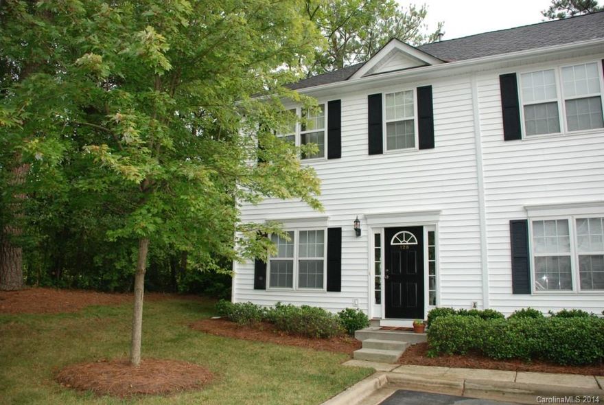 This end unit condo is move-in ready! The Living Room features crown molding & neutral paint & carpet. The Kitchen has ceramic tile floors & a dining area that overlooks the private patio and wooded area.  The upstairs boasts two large bedrooms, each with their own baths & walk-in closets.  All appliances, including washer & dryer are included! Within walking distance to downtown Pineville & adjacent to Jack D. Hughes Memorial Park! Visit www.pinevillenc.net for area information. Must see!