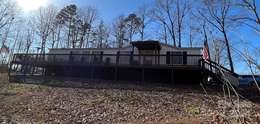 What an adorable split floor plan, 3 bedroom, 2.5 bath home!  This home features a kitchen island, wood burning fireplace, garden tub, walk in closet in owner's suite, and so much more.  The exterior has a beautiful full length deck that was built in 2019.